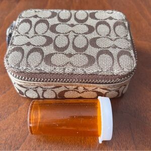 Coach Tan/Khaki Signature print pouch! Perfect 4 pills/chap stick, sanitizer!